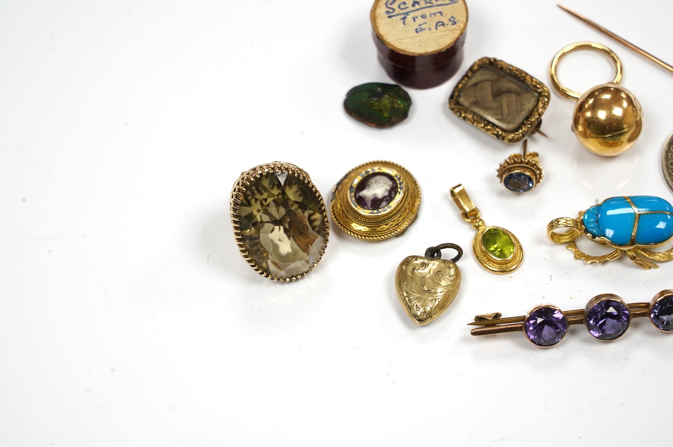 Assorted jewellery etc. including a modern 9ct gold and citrine fob, Victorian mourning brooch and a scarab beetle. Condition - poor to fair